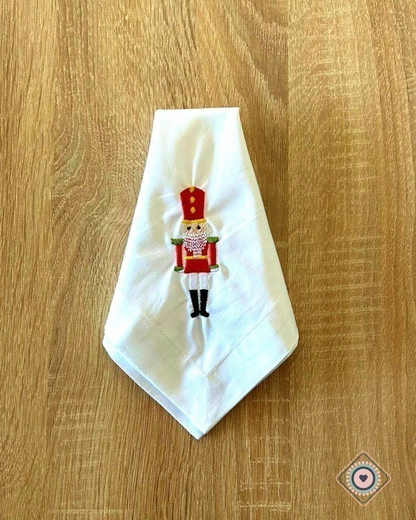 Servilleta de Tela Bordada color blanco Cascanueces rojo